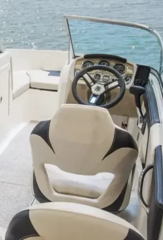 Vibrant blue and white striped upholstery on a boat's seating.