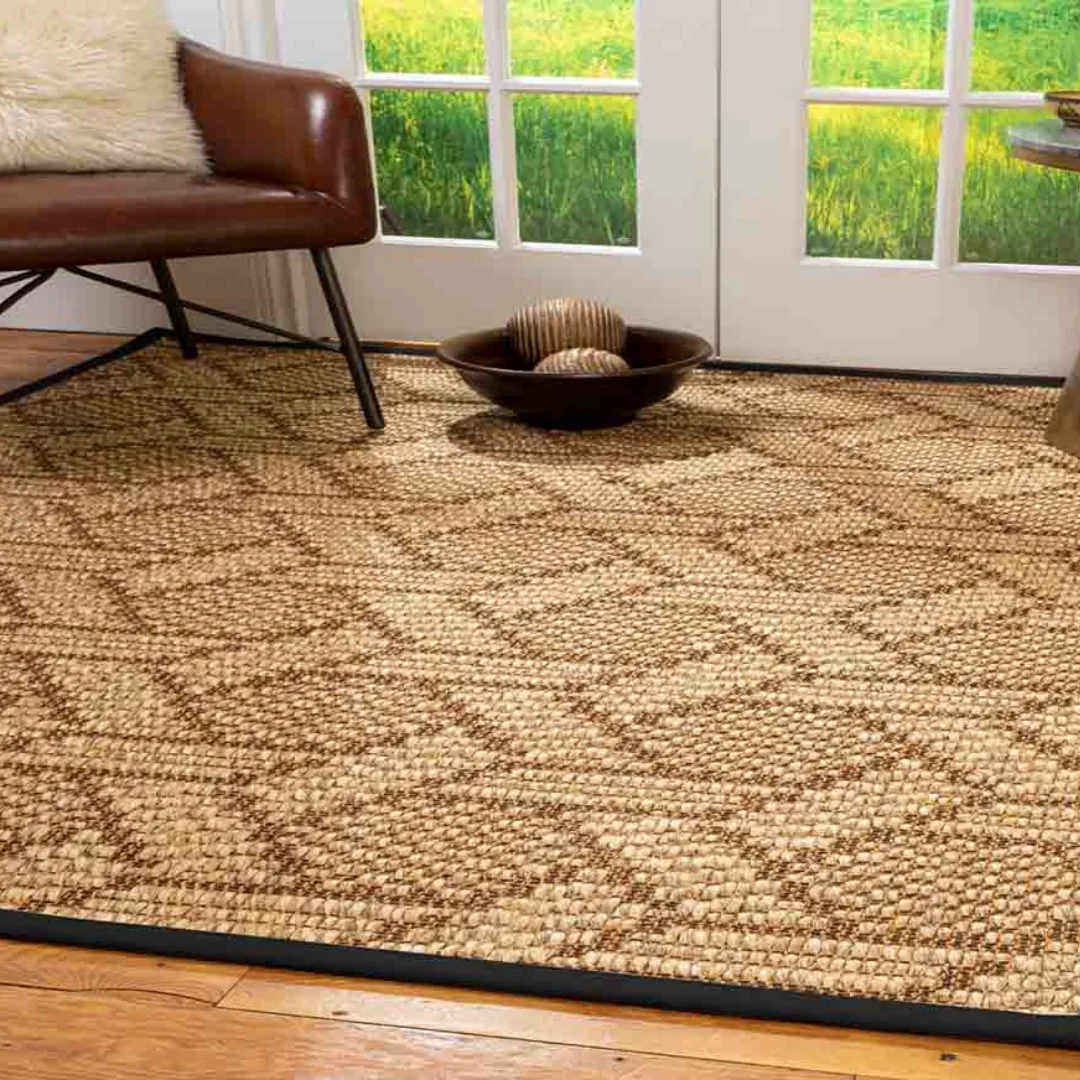 Detailed view of a handwoven sisal carpet's craftsmanship.