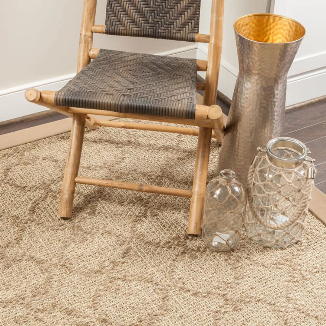 Brightly lit room beautifully contrasted with a sisal carpet.
