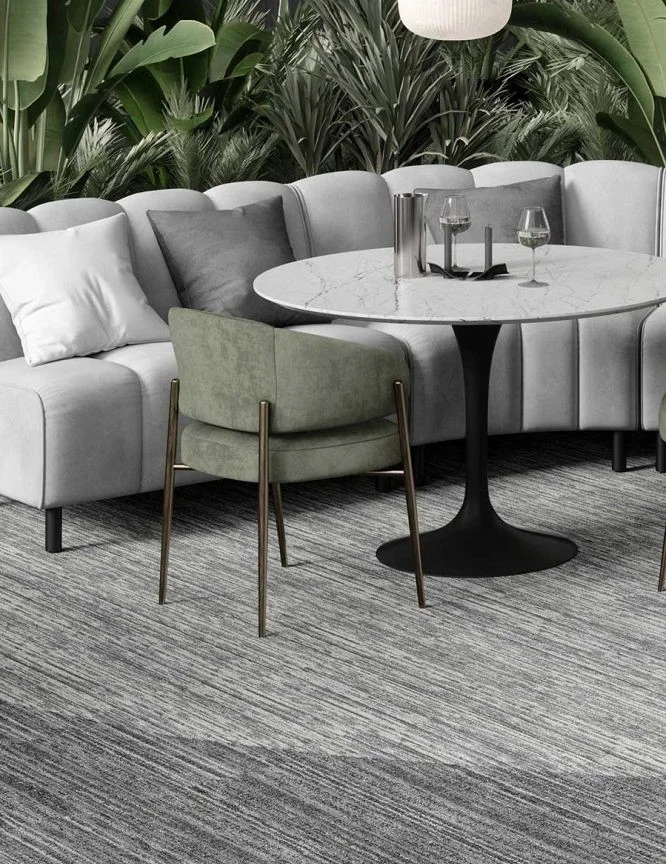 Room with sound-dampening carpet and soft furnishings