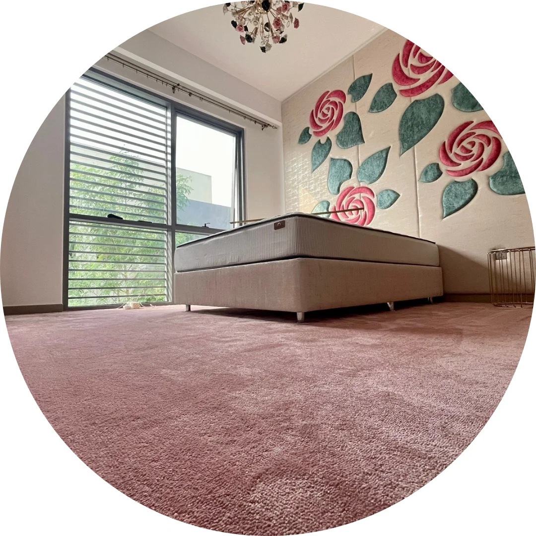 A serene bedroom enhanced by soft wall-to-wall carpeting.